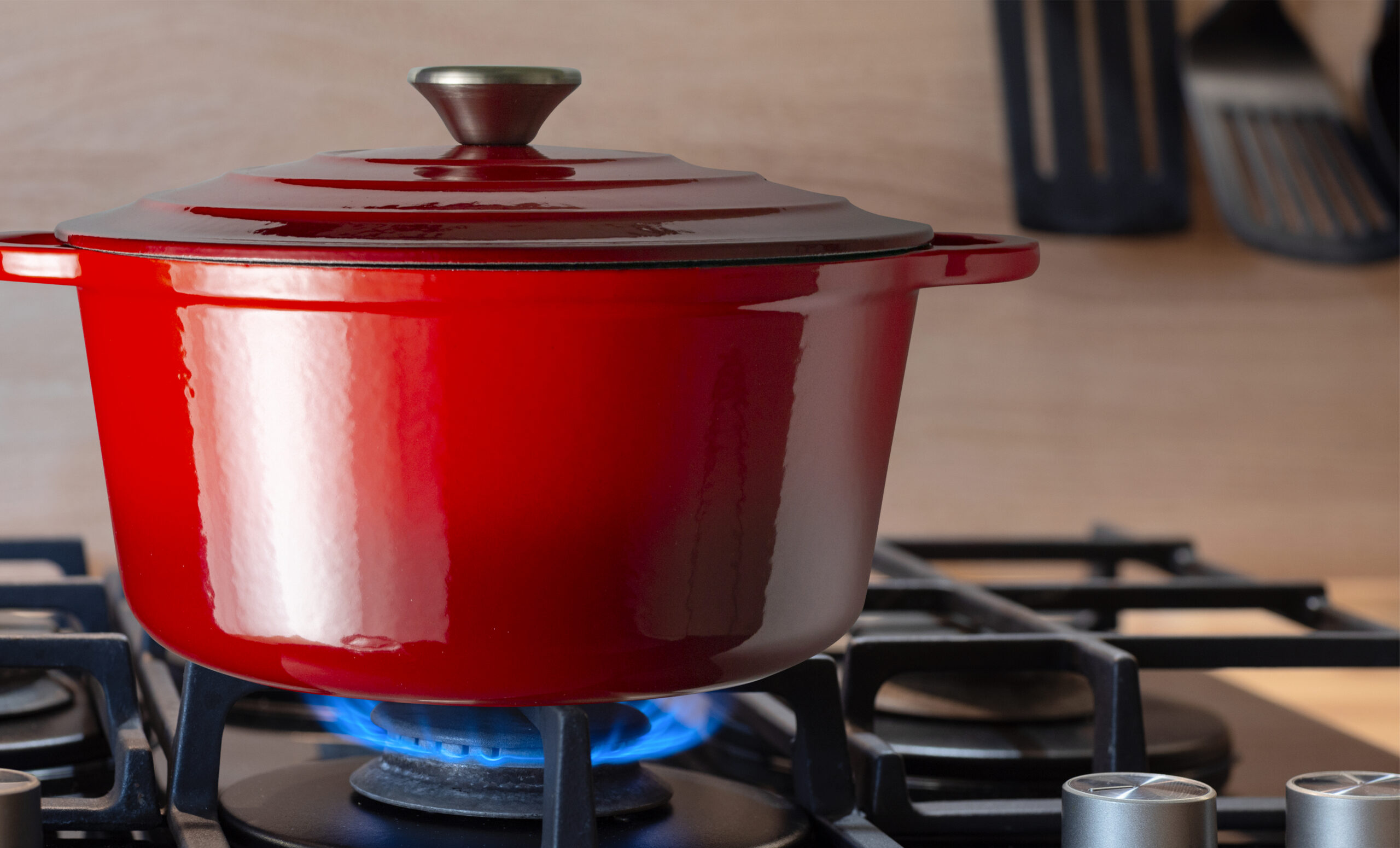 pot on gas stove, stainless pan on the hob, cooking on a gas stove, the cost of gas in Europe